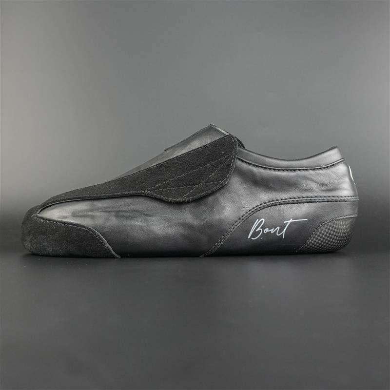 Side view of the Envy suede skate showing black suede finish