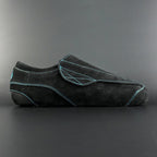 Side view of the Envy suede skate showing black suede finish