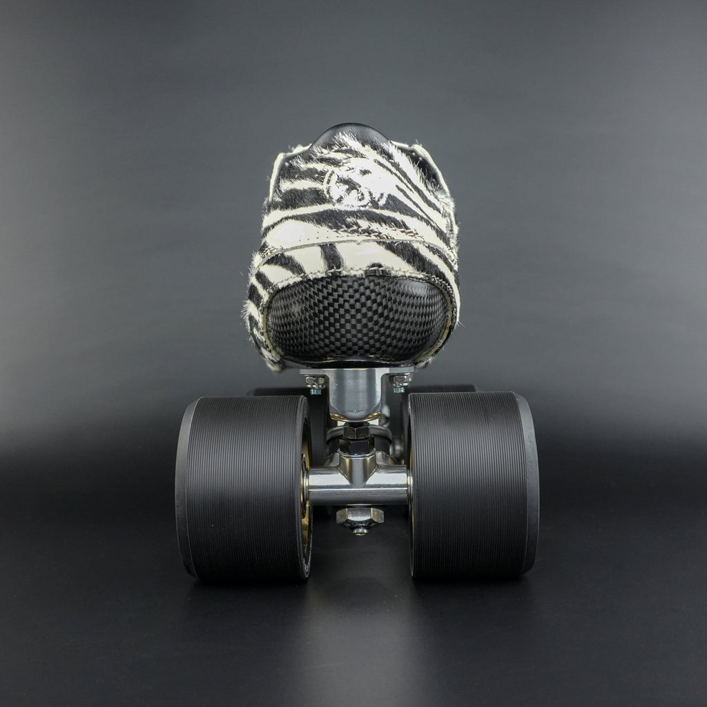 Skater wearing Envy Cow Zebra Print Style Roller Skates in motion