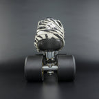 Skater wearing Envy Cow Zebra Print Style Roller Skates in motion