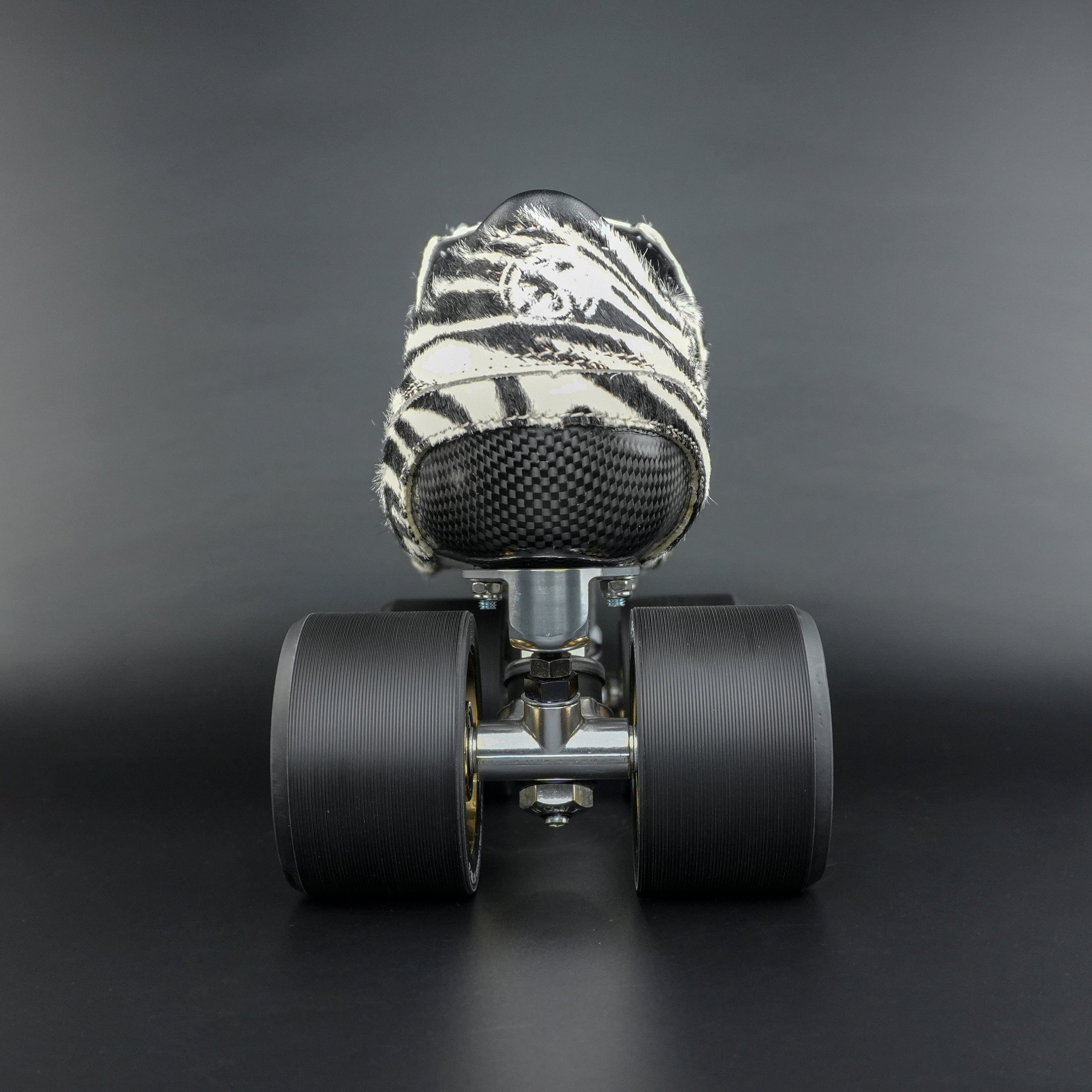 Skater wearing Envy Cow Zebra Print Style Roller Skates in motion