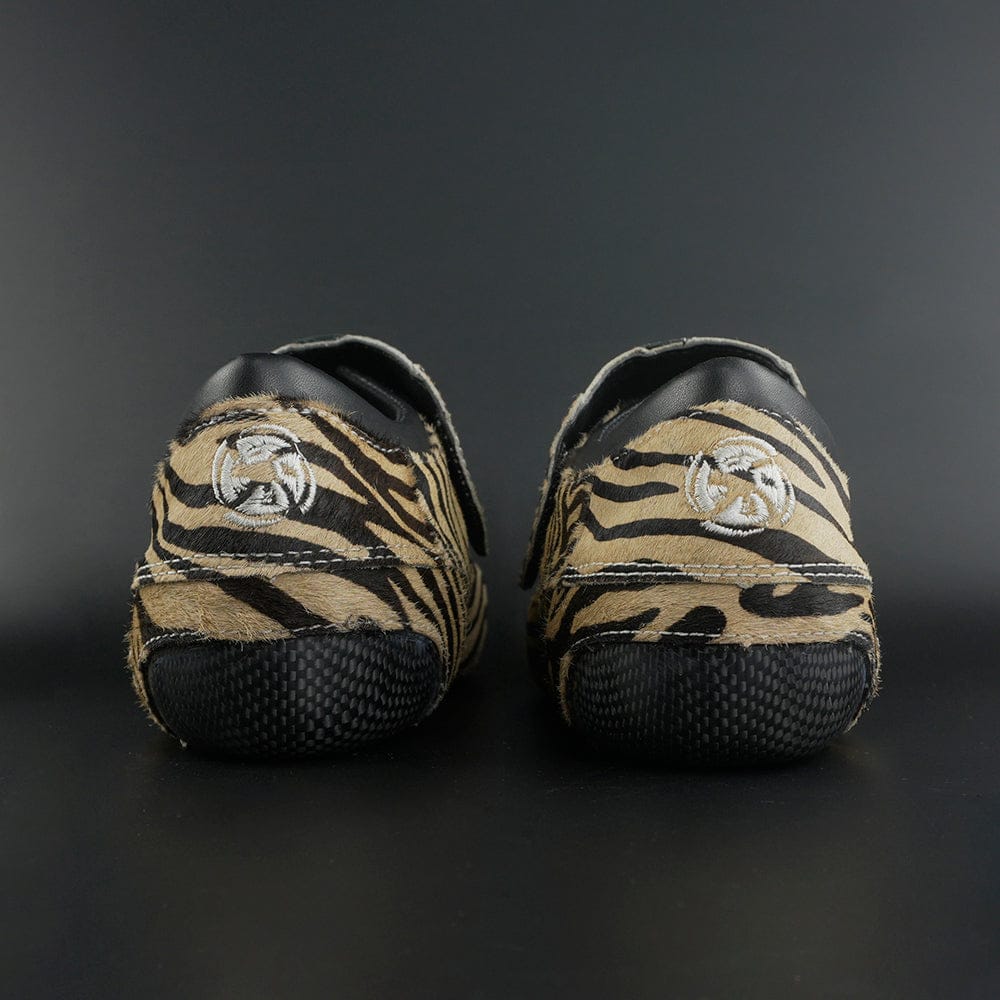 Skater wearing Envy Cow Zebra Print Style Roller Skates in motion