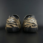 Skater wearing Envy Cow Zebra Print Style Roller Skates in motion