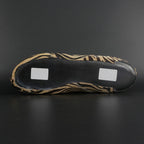 Skater wearing Envy Cow Zebra Print Style Roller Skates in motion