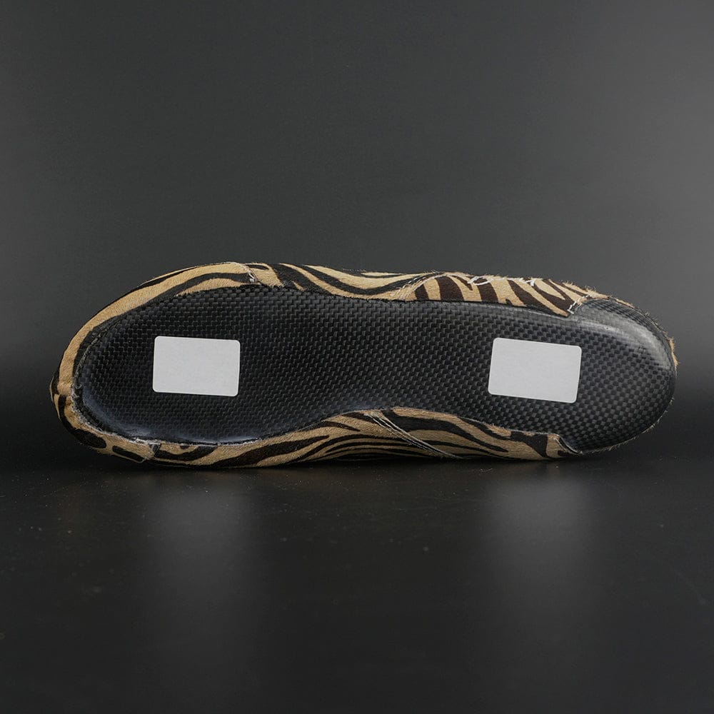 Skater wearing Envy Cow Zebra Print Style Roller Skates in motion