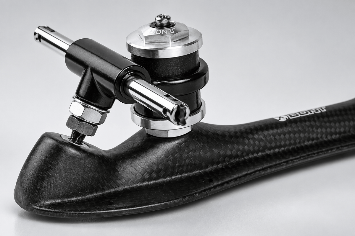 Detail of the quick-release clip axle, black 88A double-barrel cushions, and silver retainers